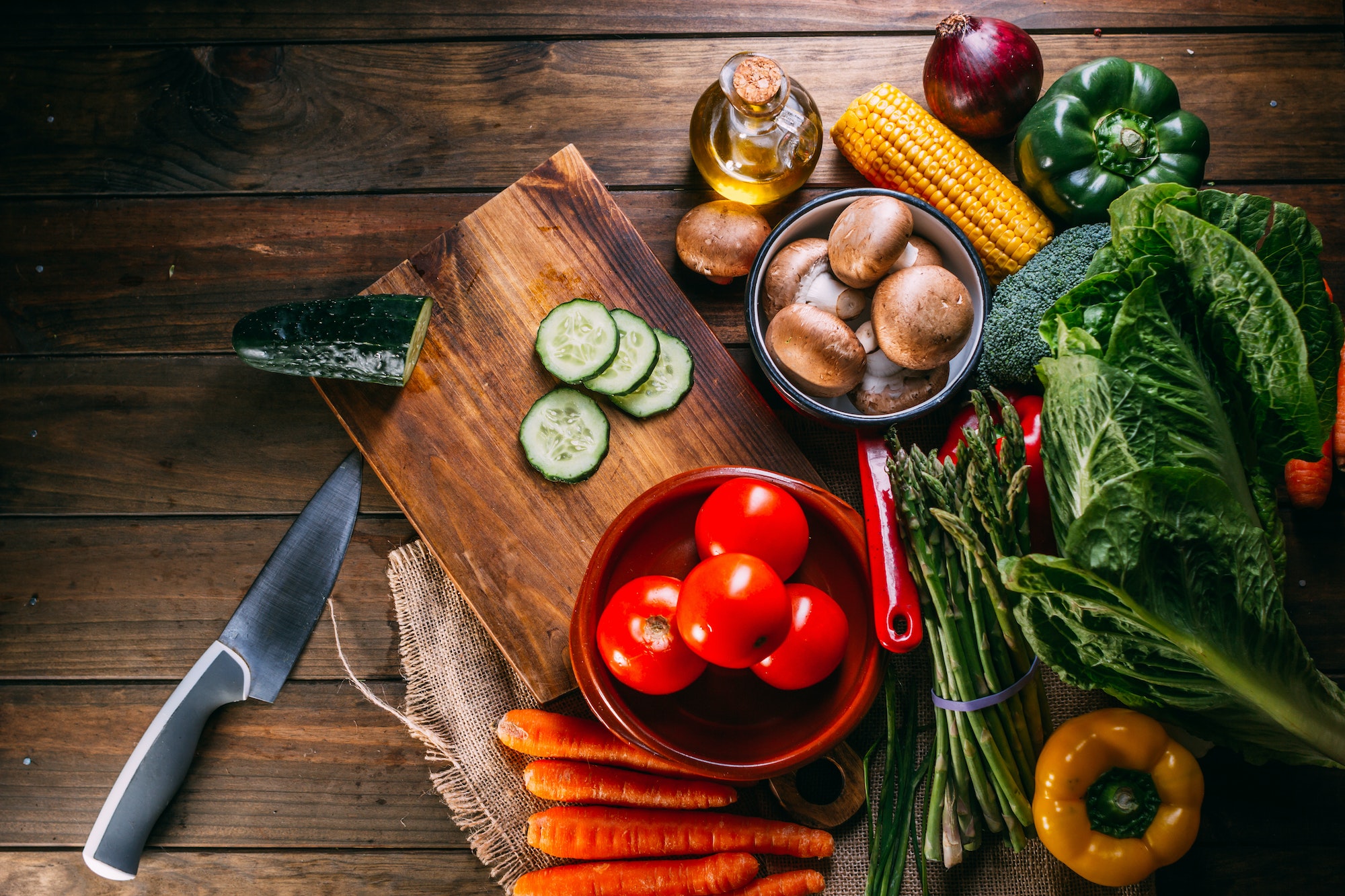 Vegetables and utensils on kitchen table